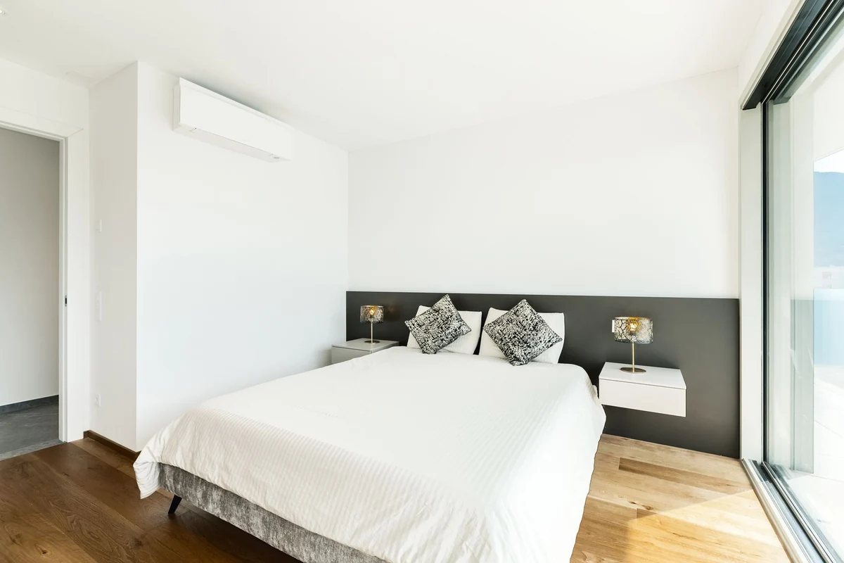 Bedroom with a wall-mounted ductless mini split